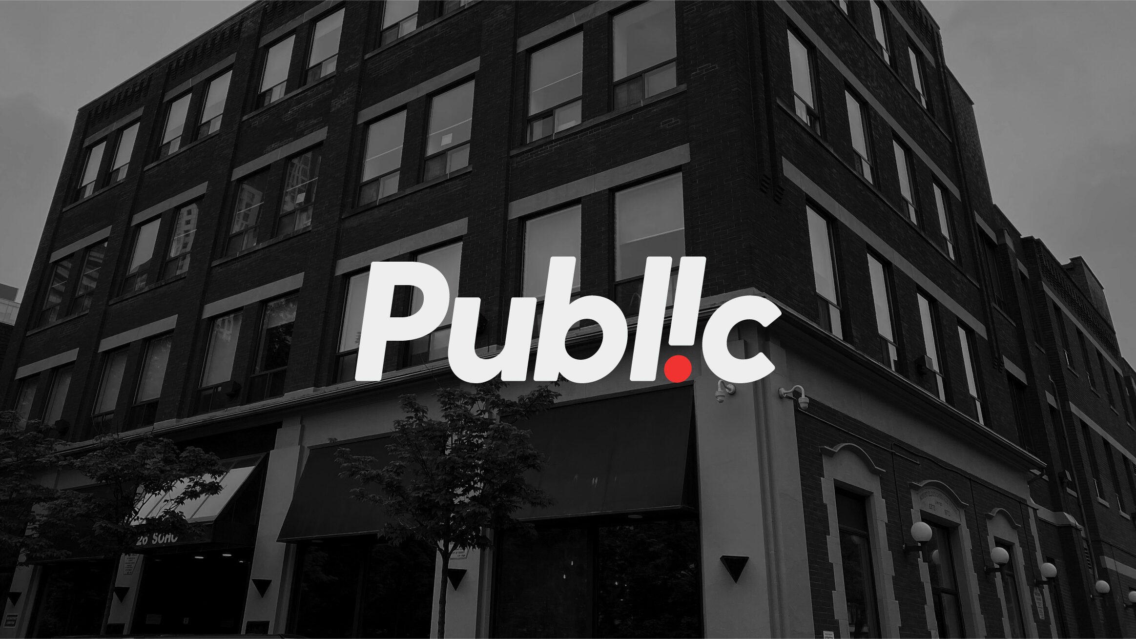 Black and white image of our office at 26 Soho Street, Toronto, with the word "Public", our logo, layered over top. 