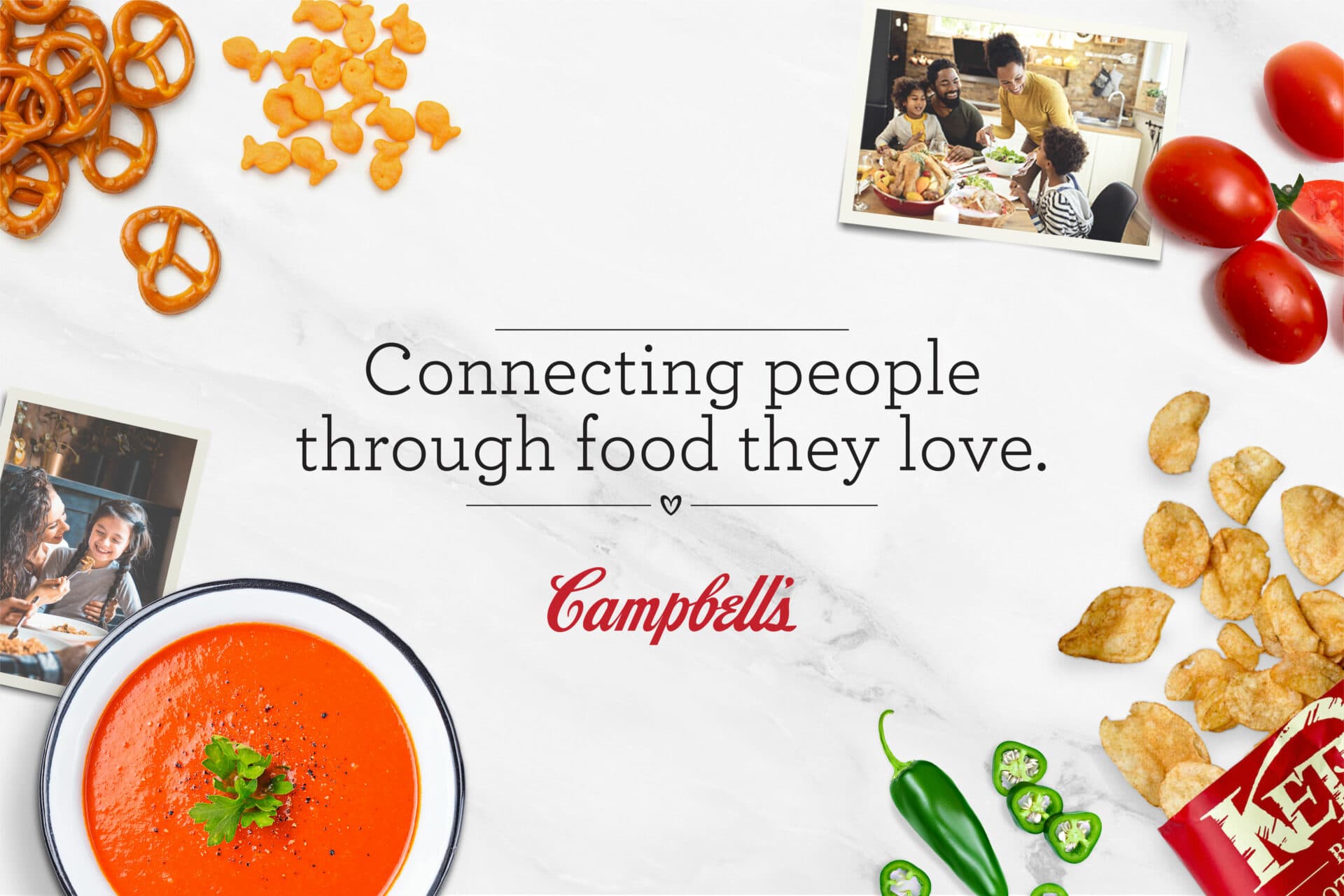 Bowl of soup on the table surrounded by peas and corn, with a photograph of a family. Text reads, "Connecting people through food they love" above the Campbell's logo