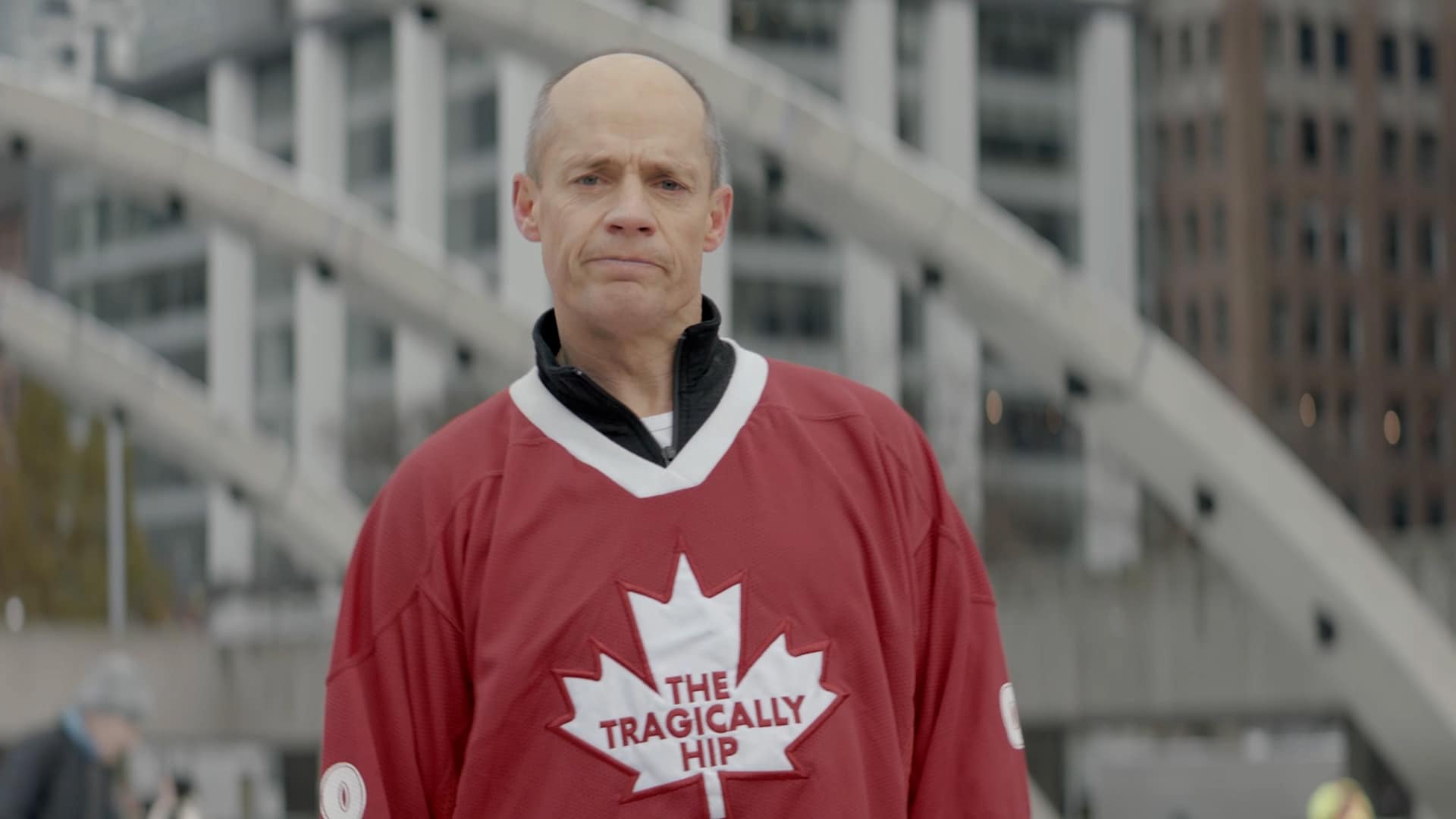 Kurt Browning, in a Tragically Hip, Canadian jersey, on the ice at Nathan Phillip's Square