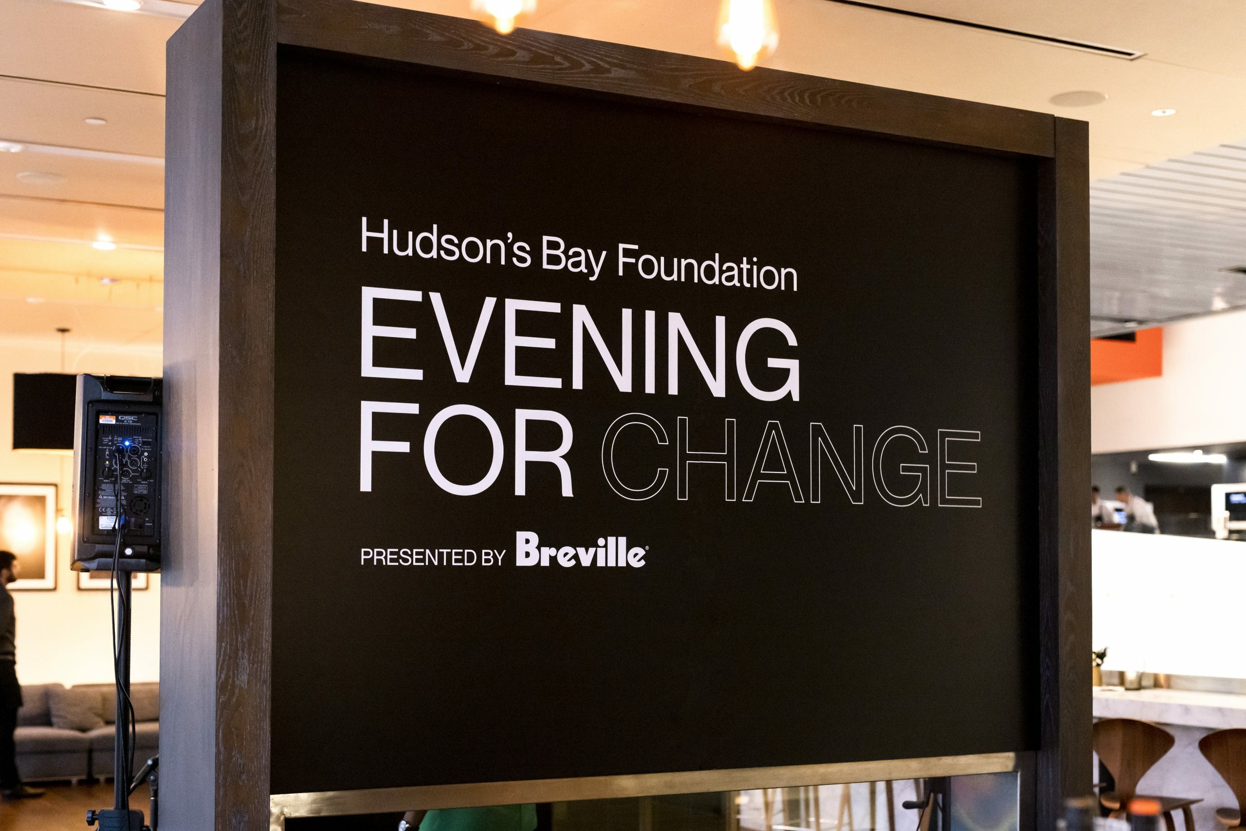 Large black signing announcing "Hudson's Bay Foundation Evening For Change - Presented by Breville"