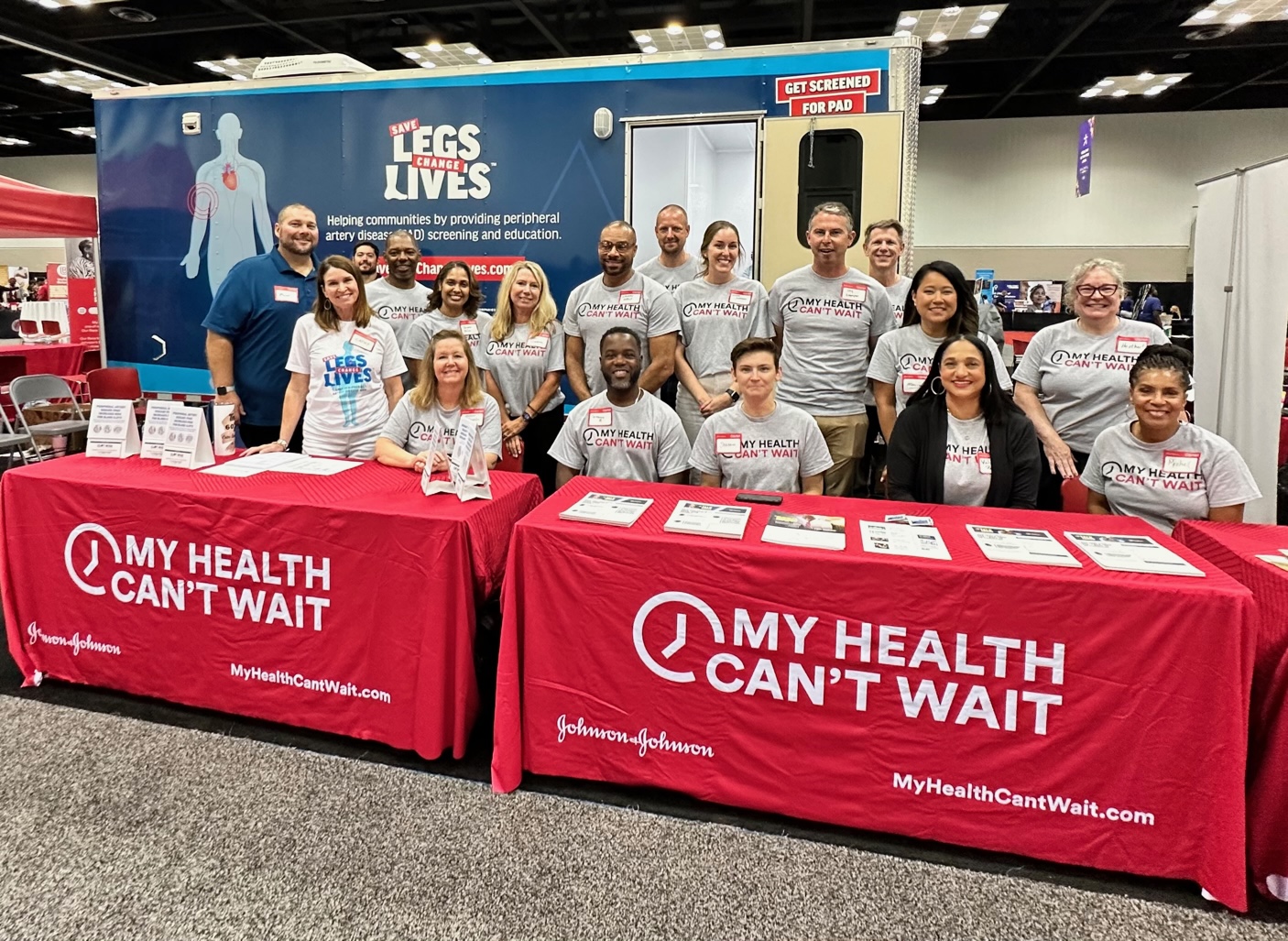 A group of volunteers at a My Health Can't Wait event booth